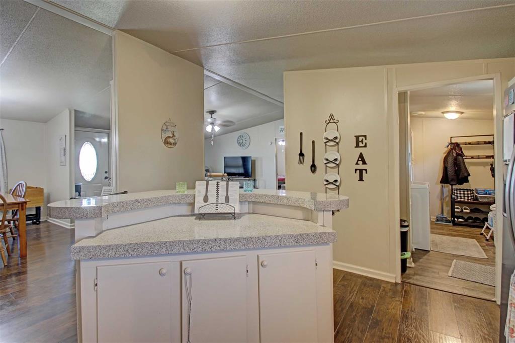 2004 Fall Creek Road Cleburne, TX 76033 - Photo 7 of 18 a bathroom with sink a mirror and shower
