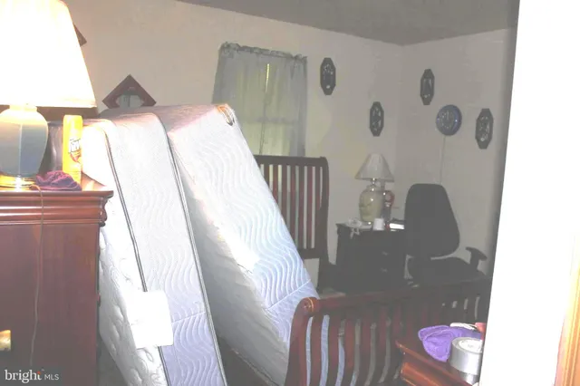 a balcony with table and chairs