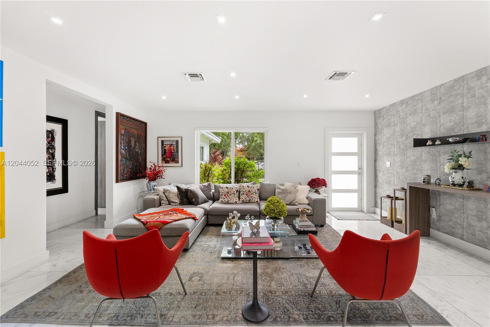 721 Bird Road Coral Gables, FL 33146 - Photo 2 of 24 a living room with furniture window and wooden floor