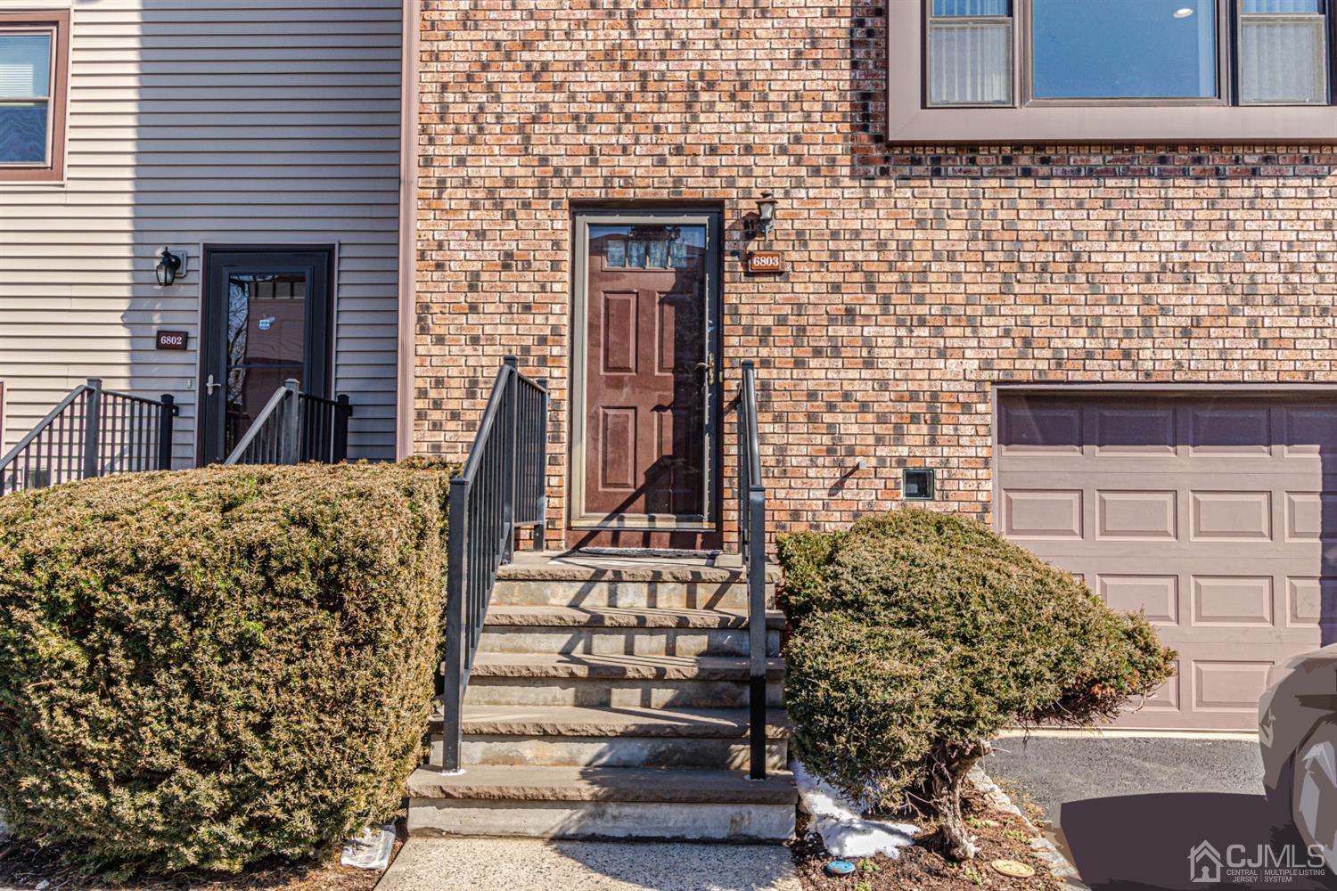 6803 Hana Road Edison, NJ 08817 - Photo 1 of 25 a view of a brick house with outdoor space