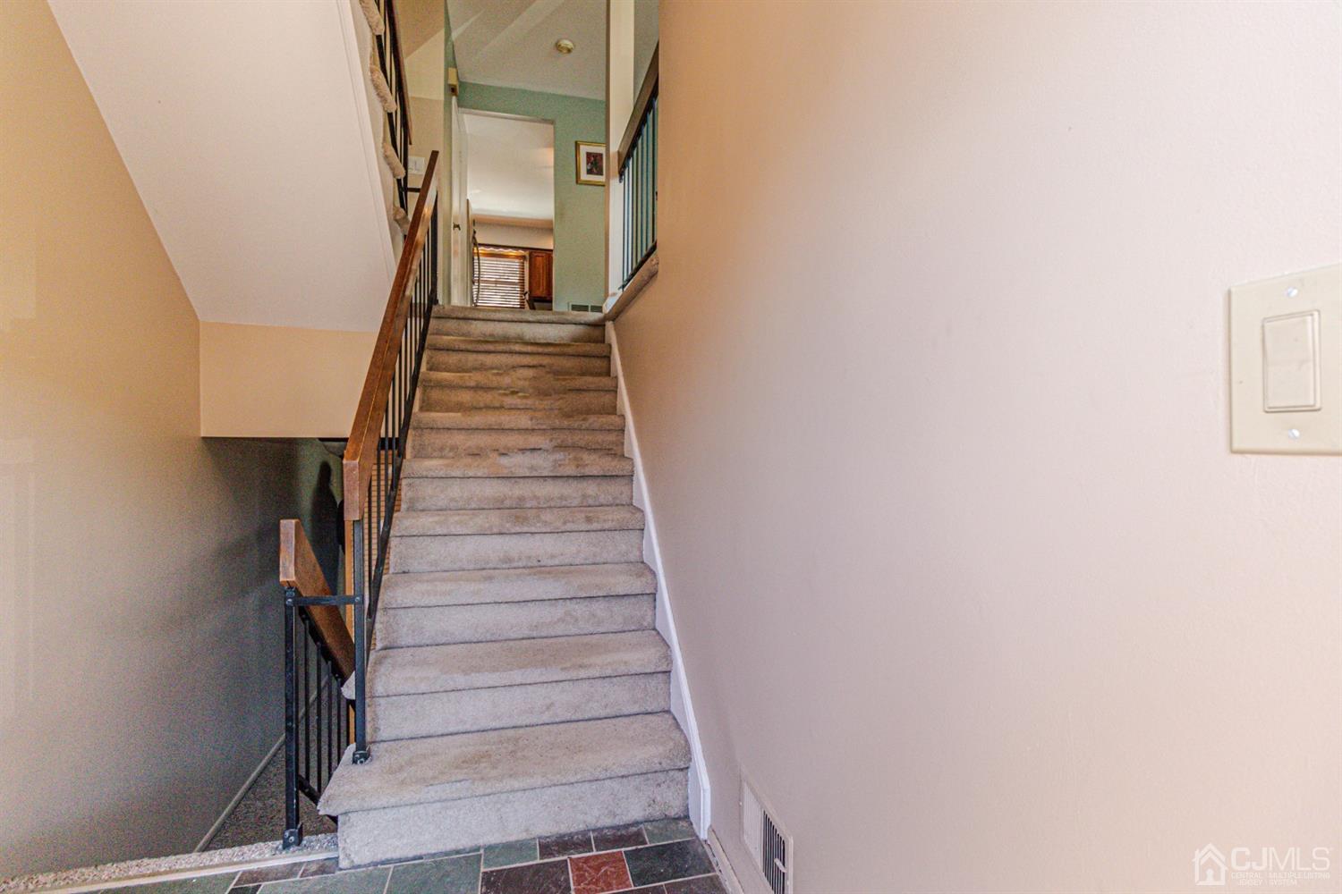 6803 Hana Road Edison, NJ 08817 - Photo 2 of 25 a view of entryway and hall with wooden floor