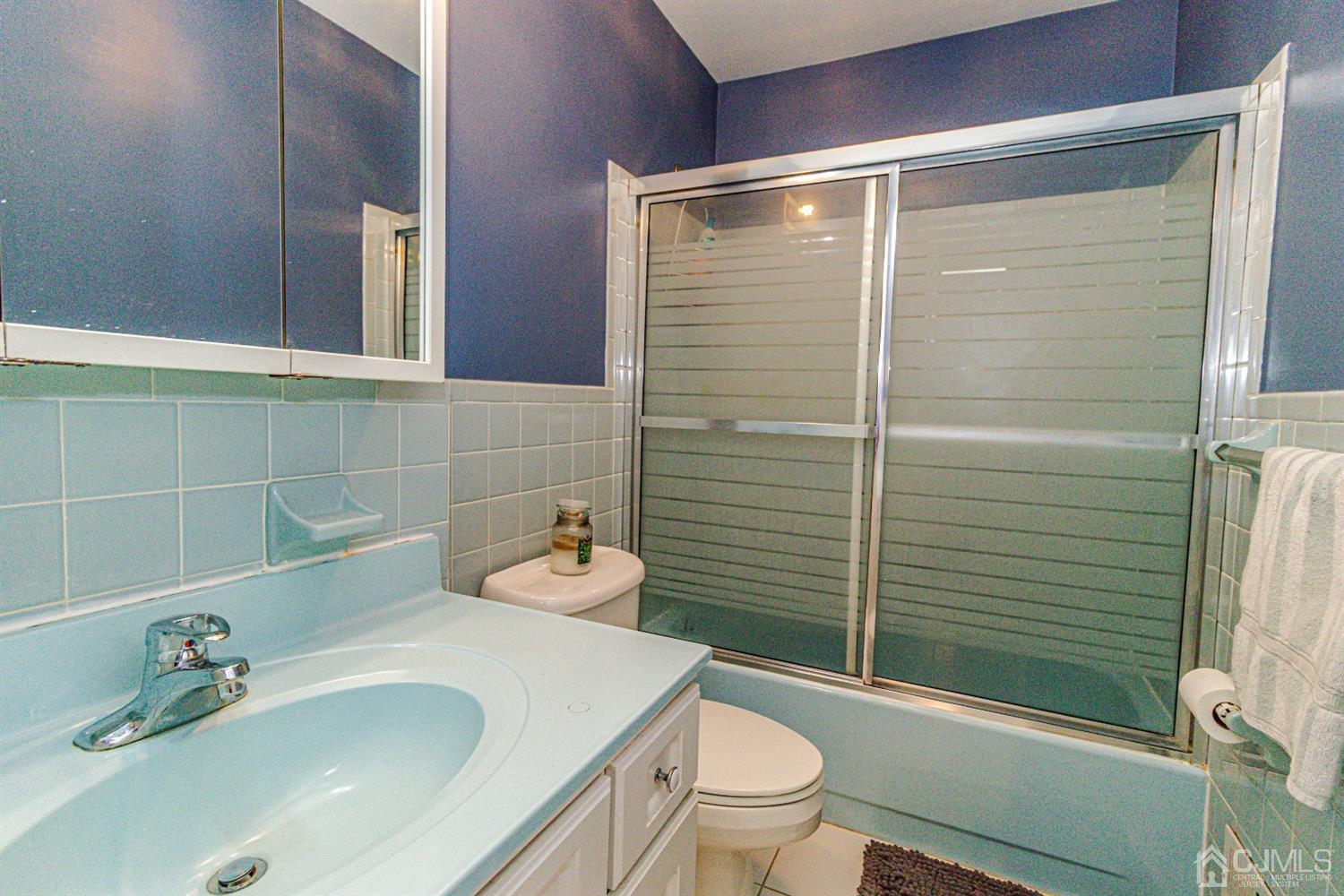 6803 Hana Road Edison, NJ 08817 - Photo 13 of 25 a bathroom with a sink toilet and shower