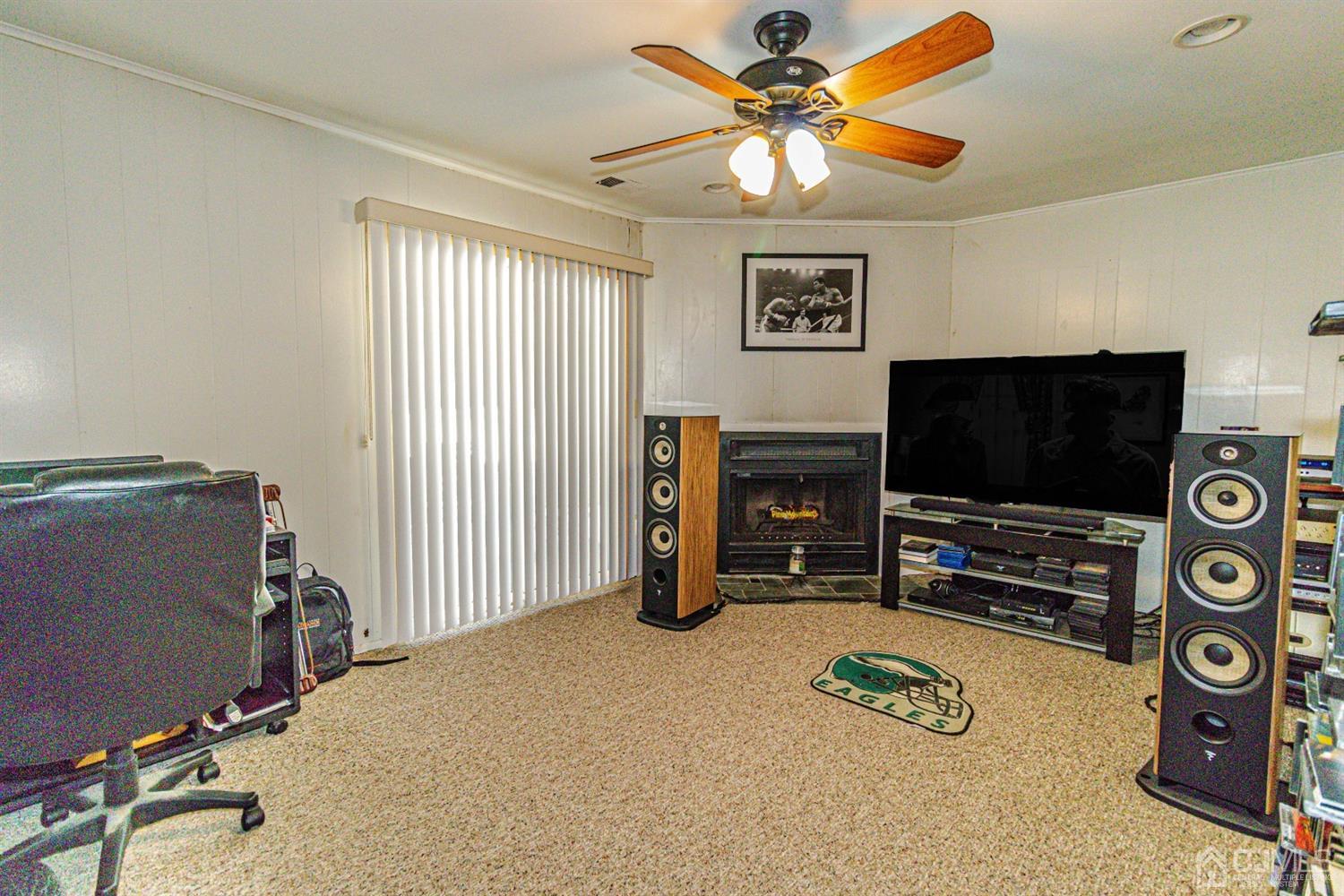 6803 Hana Road Edison, NJ 08817 - Photo 17 of 25 a room with furniture and a flat screen tv