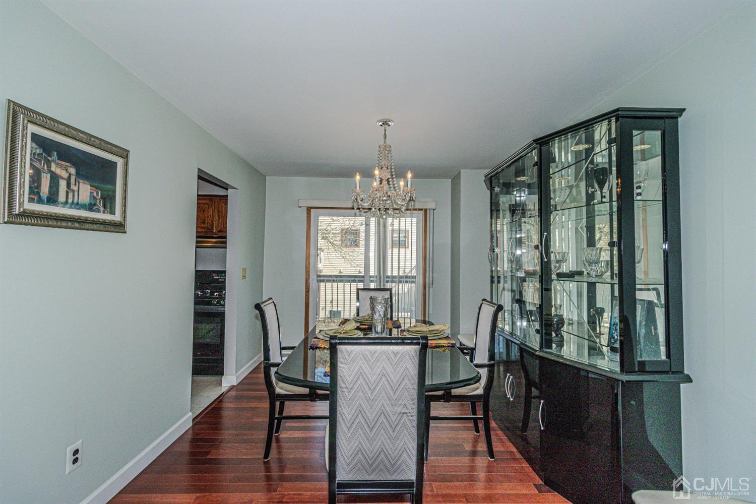 6803 Hana Road Edison, NJ 08817 - Photo 7 of 25 a view of a dining room with furniture window and wooden floor