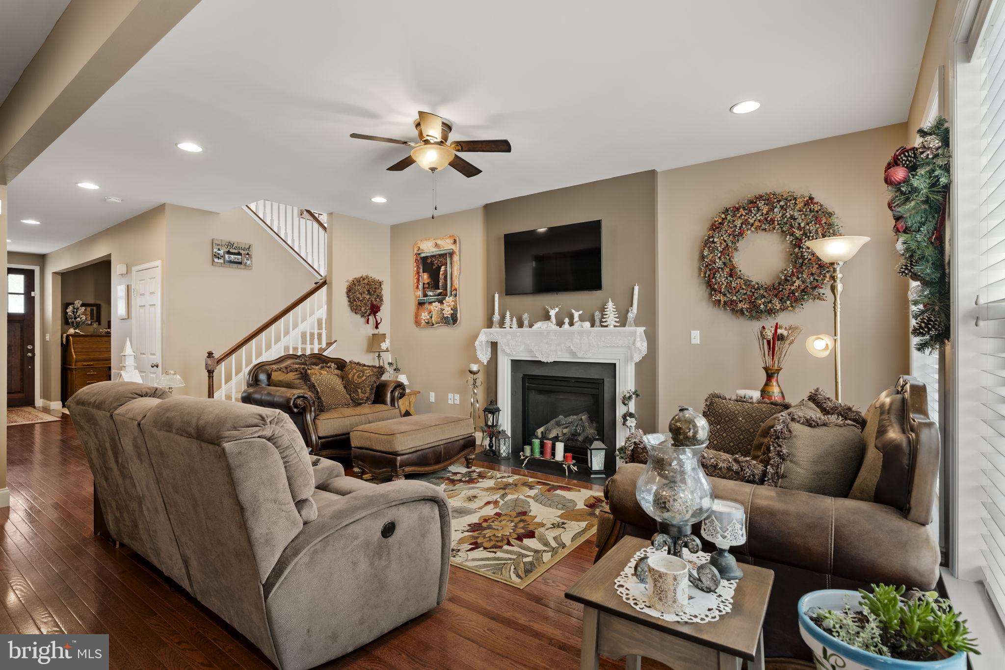 8 White Tail Path Lancaster, PA 17602 - Photo 13 of 51 a living room with furniture a fireplace and a flat screen tv