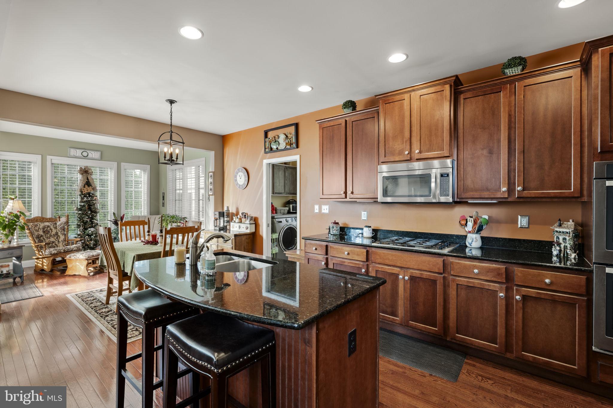 8 White Tail Path Lancaster, PA 17602 - Photo 17 of 51 a kitchen with stainless steel appliances granite countertop a sink a stove and cabinets