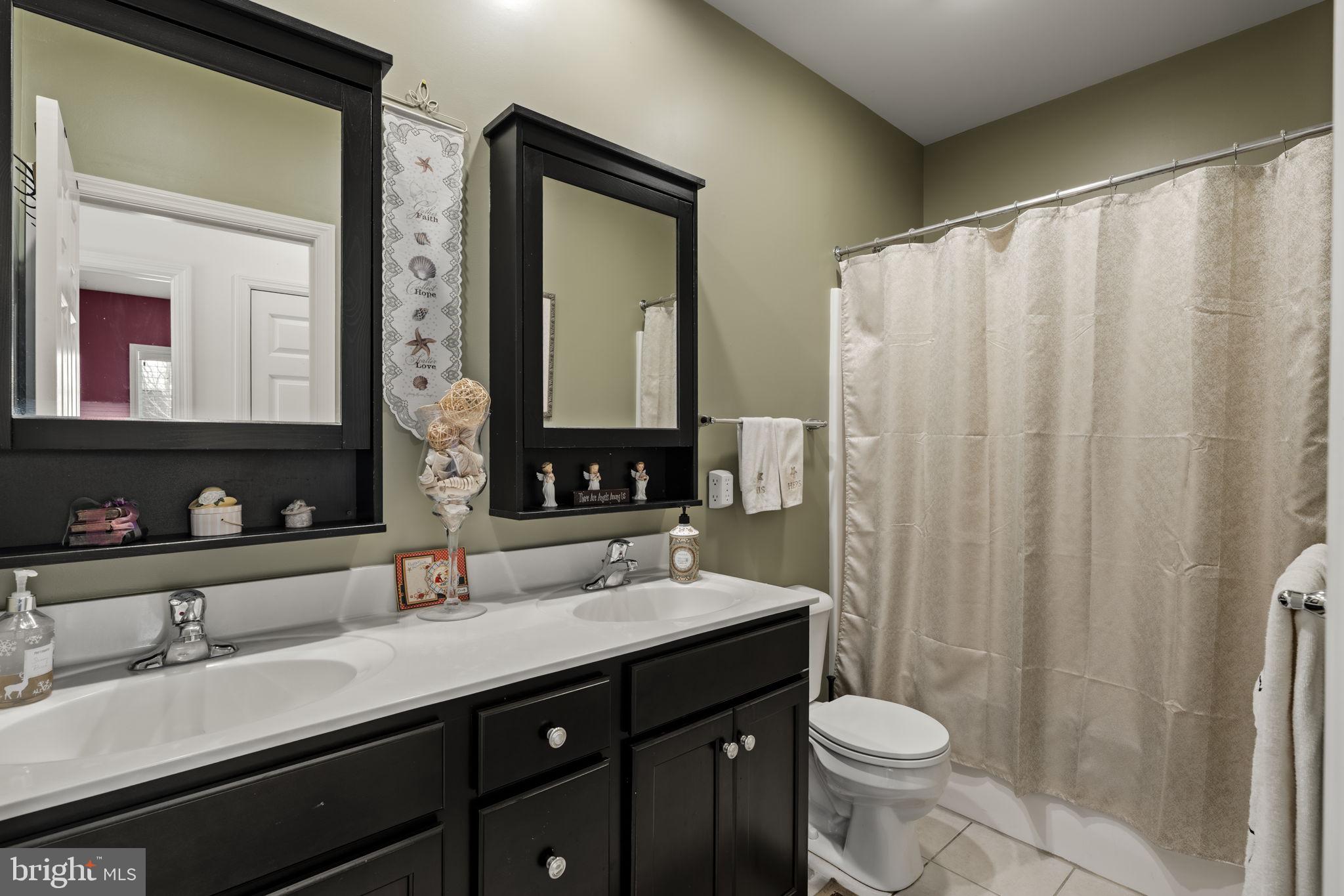8 White Tail Path Lancaster, PA 17602 - Photo 40 of 51 a bathroom with a double vanity sink toilet and a mirror