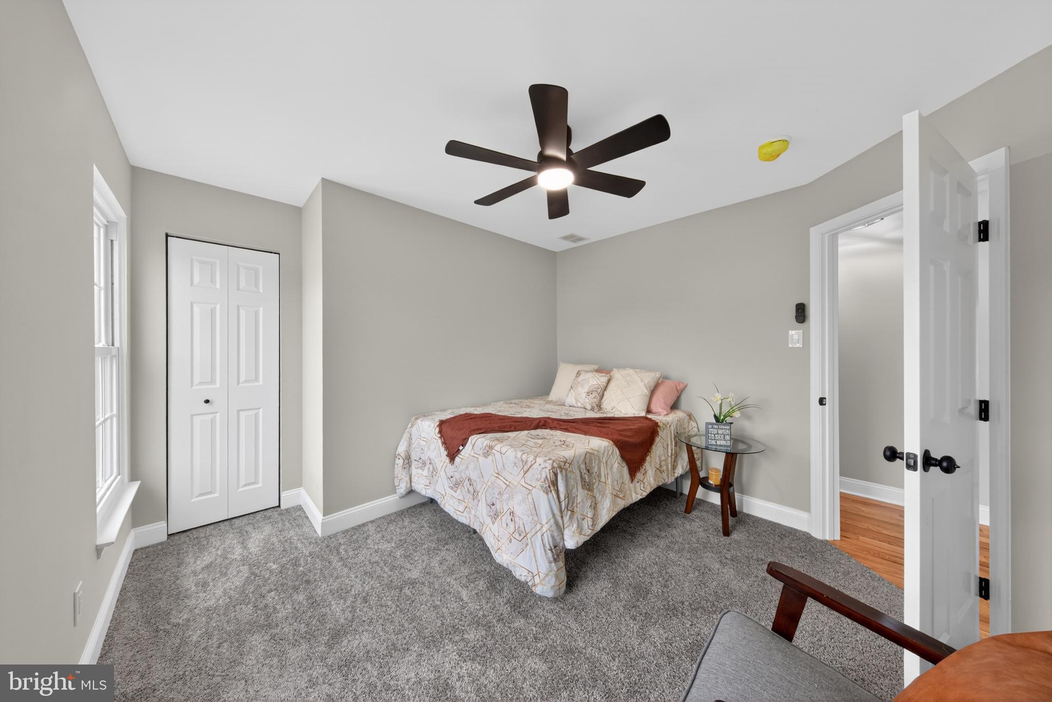 20 Baywatch Road New Castle, DE 19720 - Photo 54 of 76 a bedroom with a bed and a chandelier