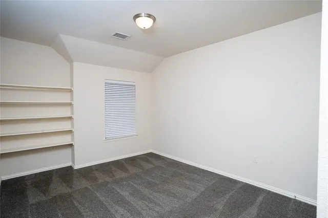 an empty room with a empty space and a window