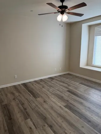 a white toilet sitting next to a bath tub