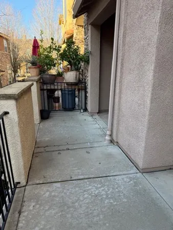 a view of a balcony with wooden fence