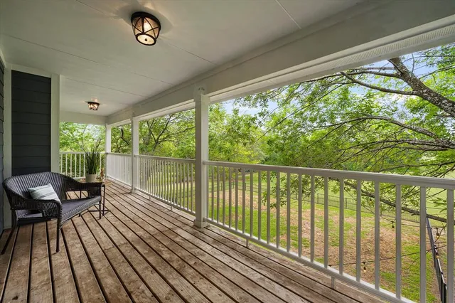 a view of balcony with furniture