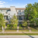 a front view of residential houses with yard