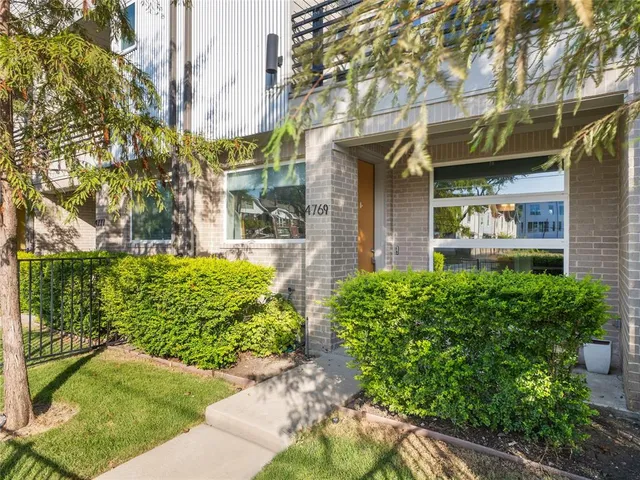 a front view of a building with garden