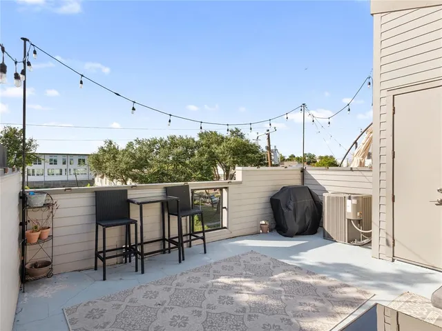 a view of a chairs and table in the patio