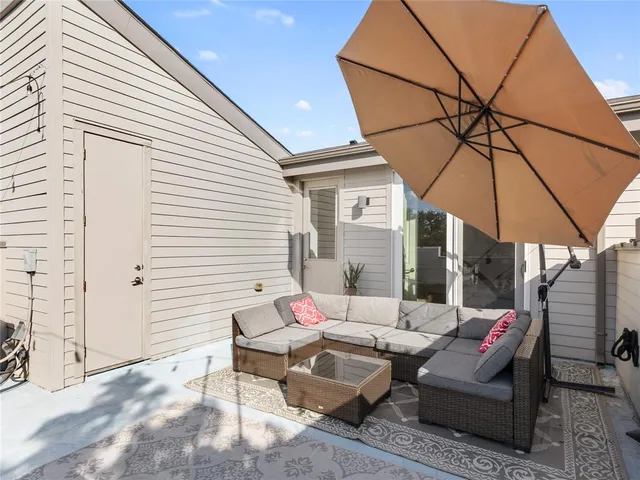 a outdoor space with patio the couches and a dining table with chairs