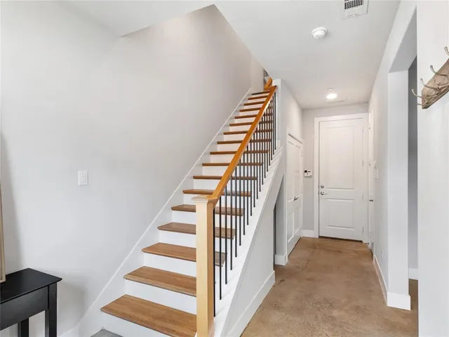 a view of a hallway with staircase