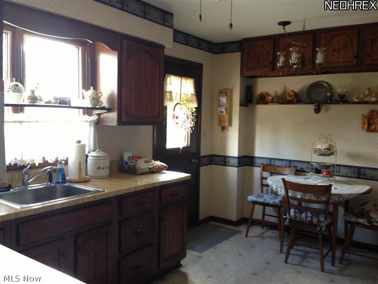 4735-4739 West Mill Road Broadview Heights, OH 44147 - Photo 2 of 22 Lots of cupboard and counter space in this charming kitchen that leads to large deck with great views.