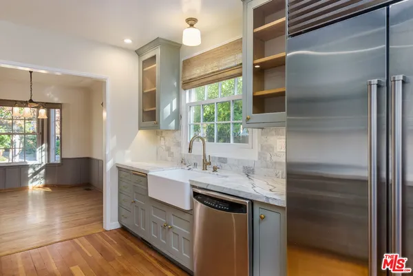 a bathroom with a shower and a glass door