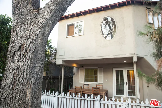a view of a house with a window and front door