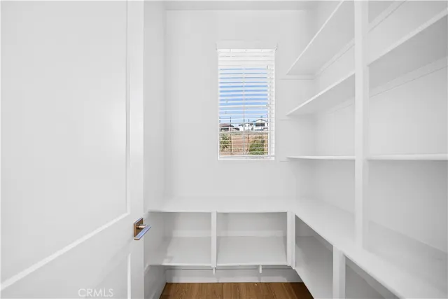 a bathroom with a sink a mirror a toilet and shower