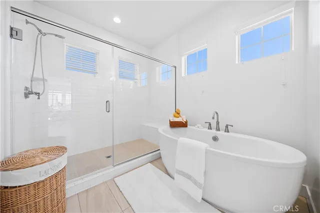 a view of a hallway with closet and bathroom
