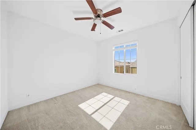 a white toilet and tub sitting next to a bathroom sink