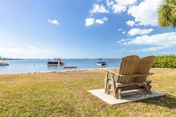 a view of a dining room with furniture and a floor to ceiling window