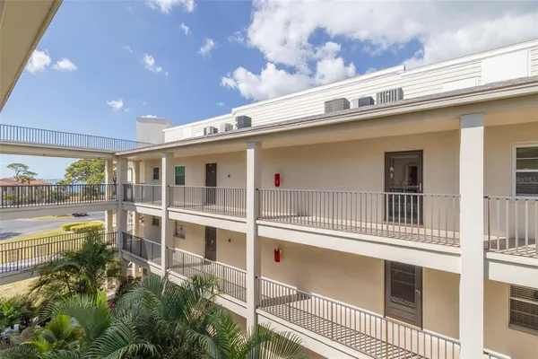 a living room with furniture a ceiling fan and a rug