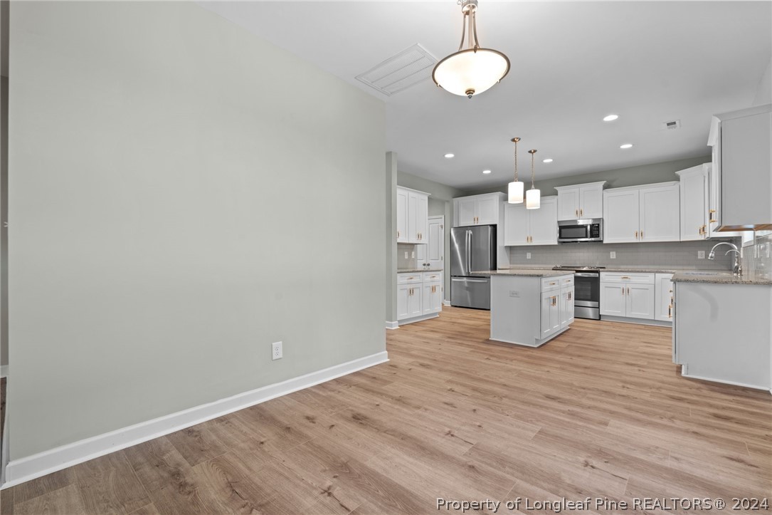 2632 Riddle Farm Road Fayetteville, NC 28306 - Photo 19 of 45 a view of kitchen with wooden floor