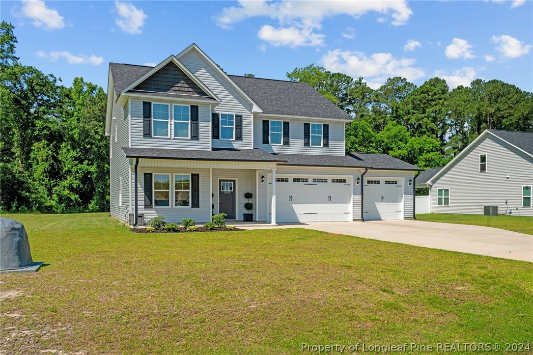 2632 Riddle Farm Road Fayetteville, NC 28306 - Photo 2 of 45 a front view of a house with a yard