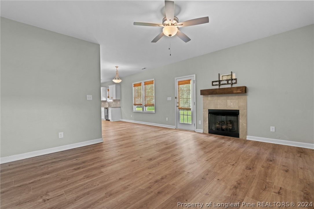 2632 Riddle Farm Road Fayetteville, NC 28306 - Photo 23 of 45 a view of an empty room with a fireplace and a window