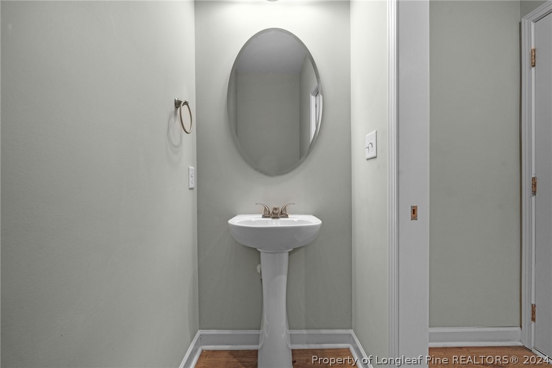 2632 Riddle Farm Road Fayetteville, NC 28306 - Photo 24 of 45 a bathroom with a sink and a mirror