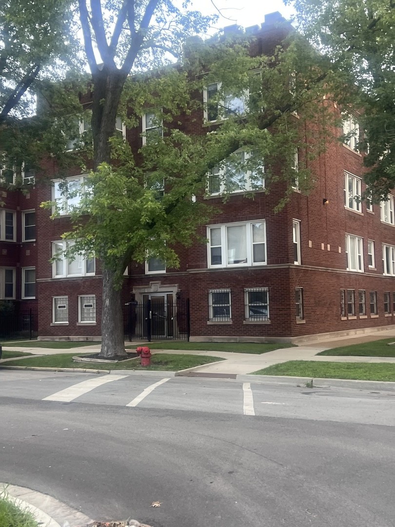 1430 East 69th Street, Unit 1S Chicago, IL 60637 - Photo 1 of 16 a front view of a building with street view