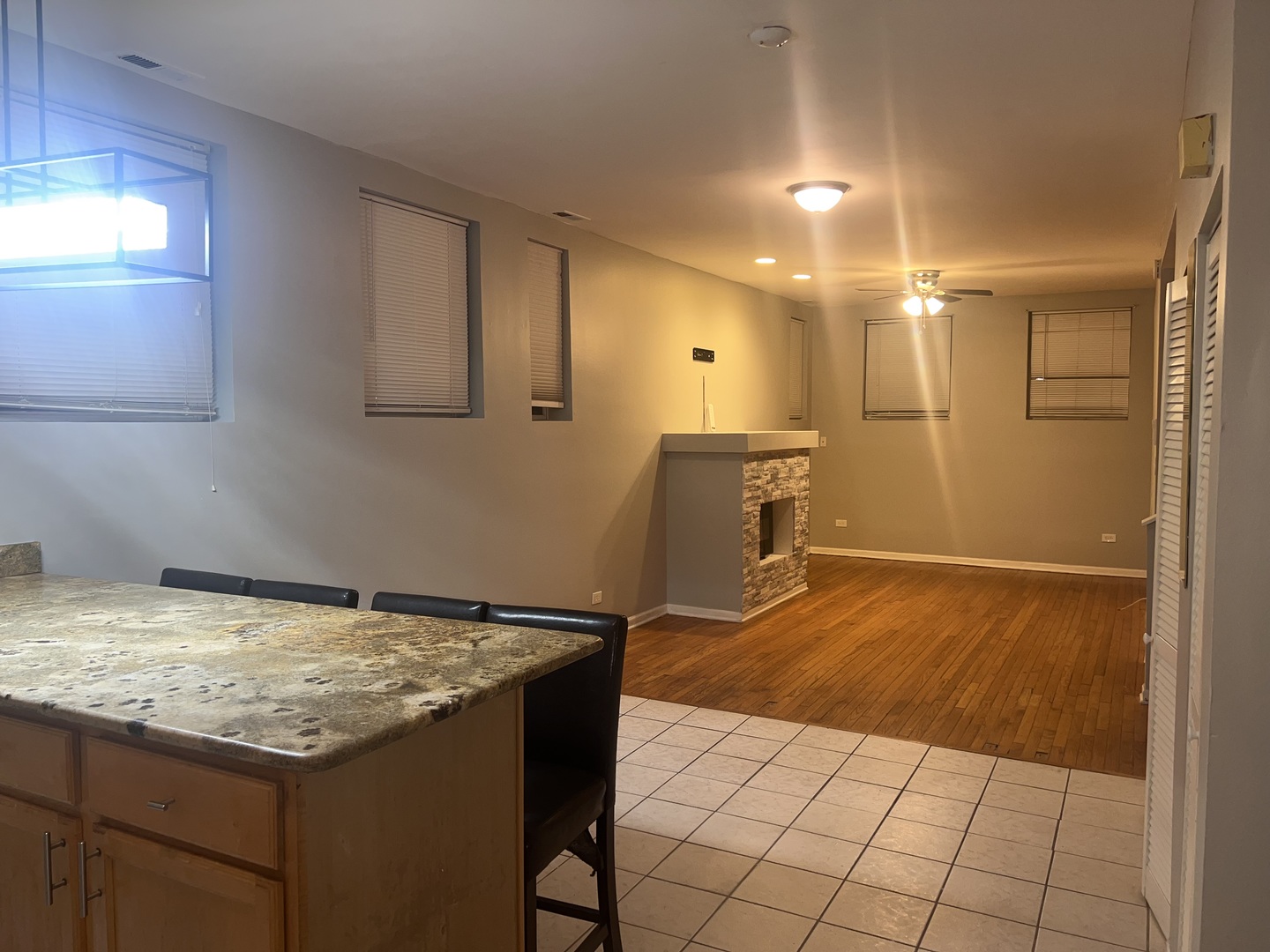 1430 East 69th Street, Unit 1S Chicago, IL 60637 - Photo 2 of 16 a bathroom with a granite countertop sink and a mirror