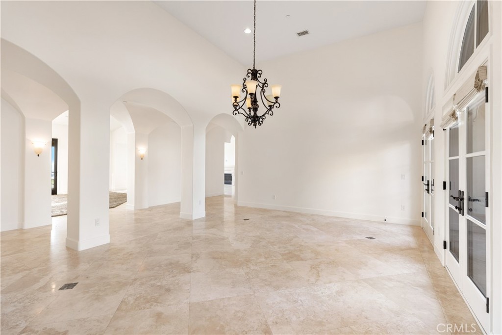 10727 West Stallion Ranch Road Shadow Hills, CA 91040 - Photo 15 of 39 a view of a chandelier and a chandelier in a room