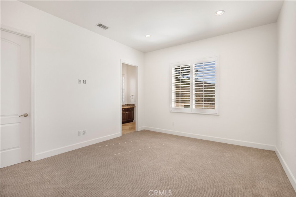 10727 West Stallion Ranch Road Shadow Hills, CA 91040 - Photo 23 of 39 a view of an empty room with a window