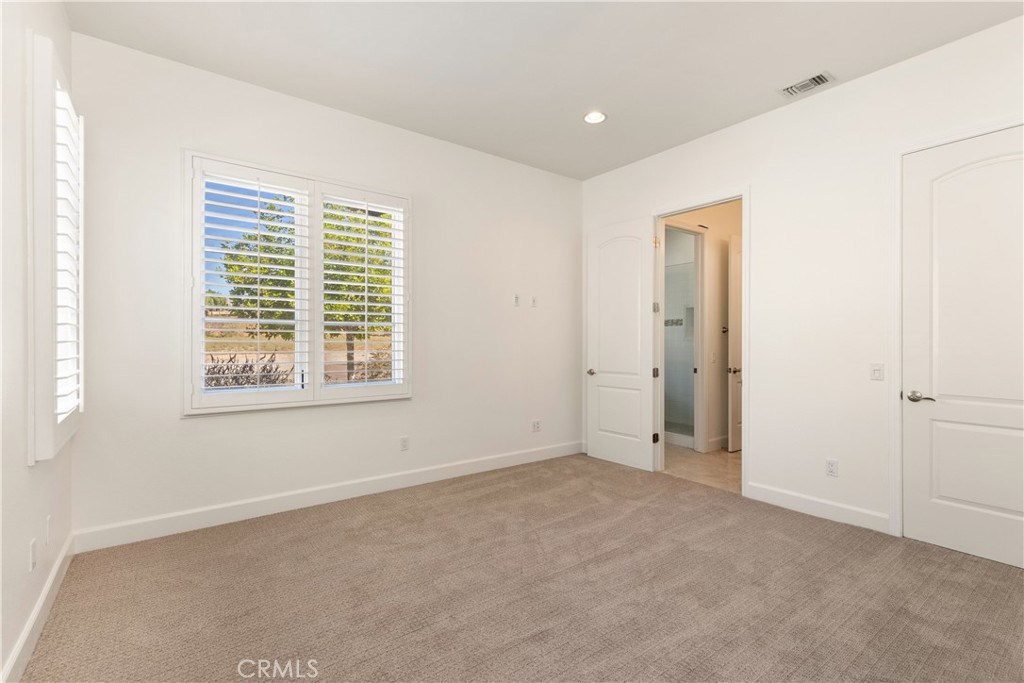 10727 West Stallion Ranch Road Shadow Hills, CA 91040 - Photo 25 of 39 a view of an empty room with a window