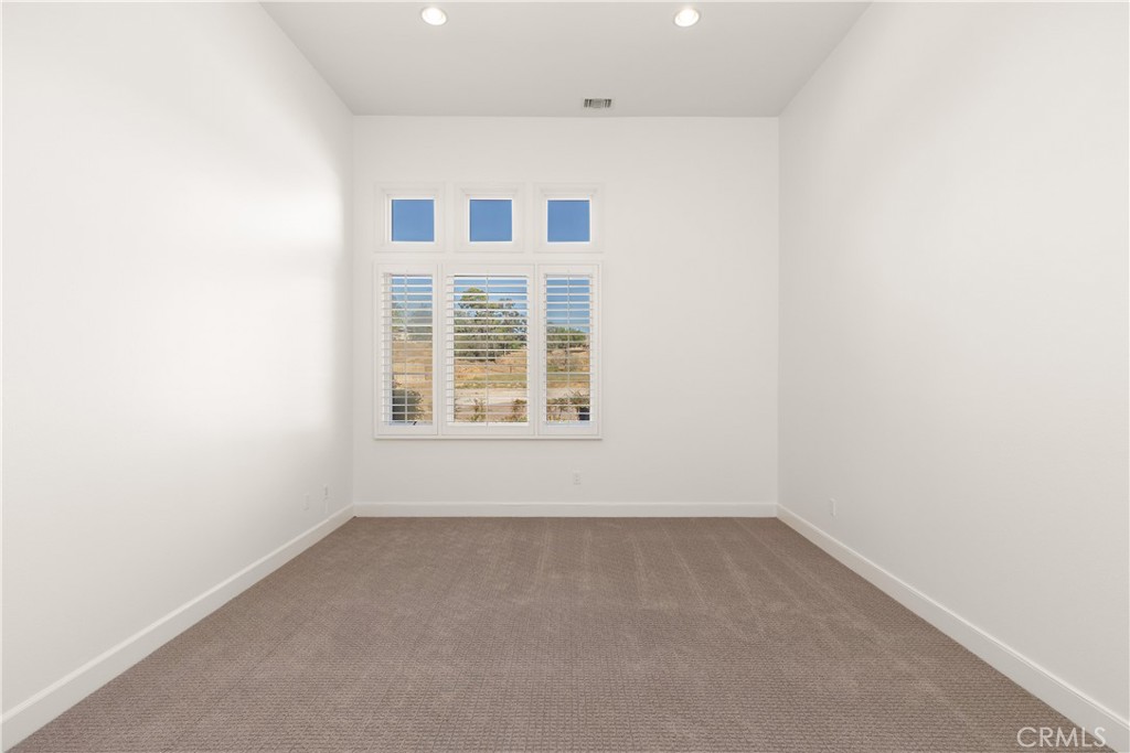 10727 West Stallion Ranch Road Shadow Hills, CA 91040 - Photo 28 of 39 an empty room with a window