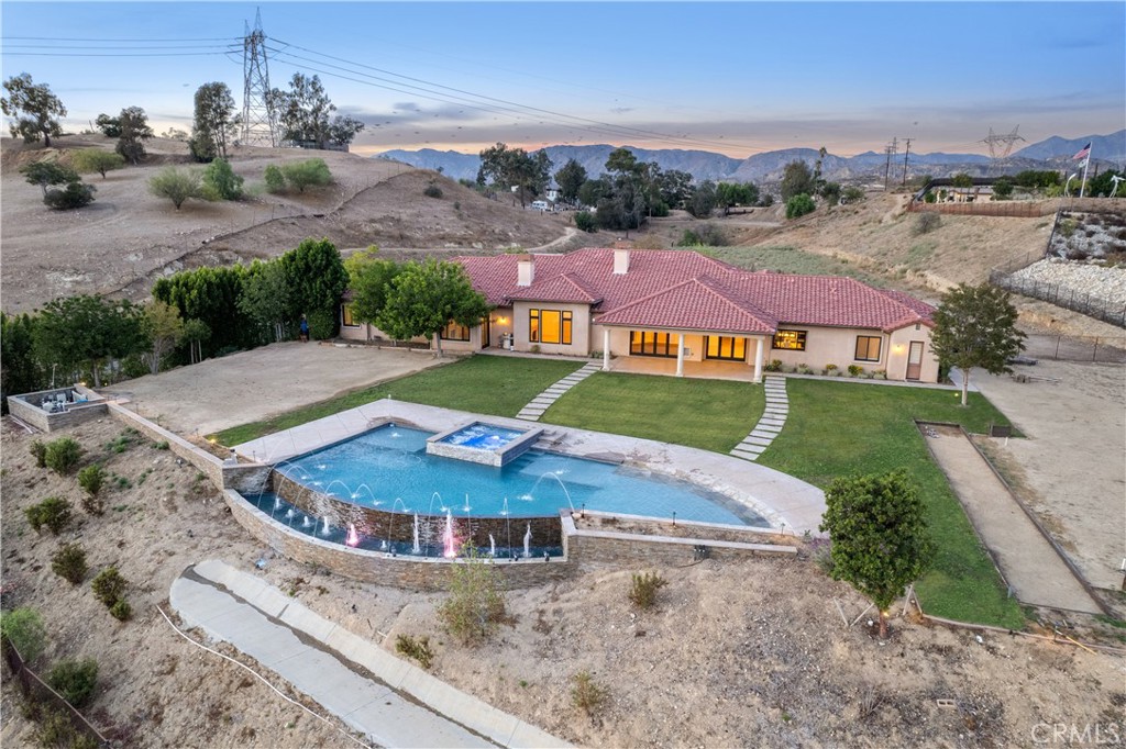 10727 West Stallion Ranch Road Shadow Hills, CA 91040 - Photo 34 of 39 an aerial view of residential houses with outdoor space and trees