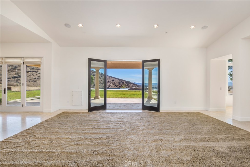 10727 West Stallion Ranch Road Shadow Hills, CA 91040 - Photo 10 of 39 a view of an empty room with a window