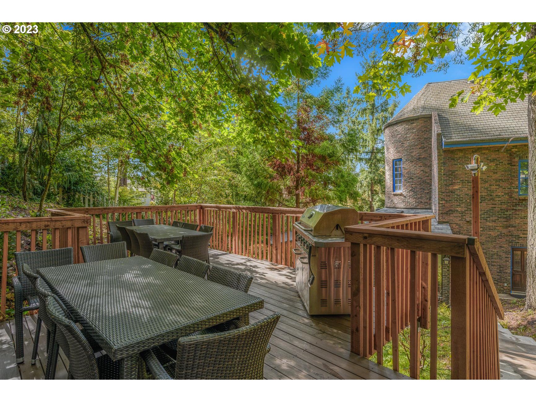 4224 Southwest Melville Avenue Portland, OR 97239 - Photo 12 of 48 a balcony with table and chairs