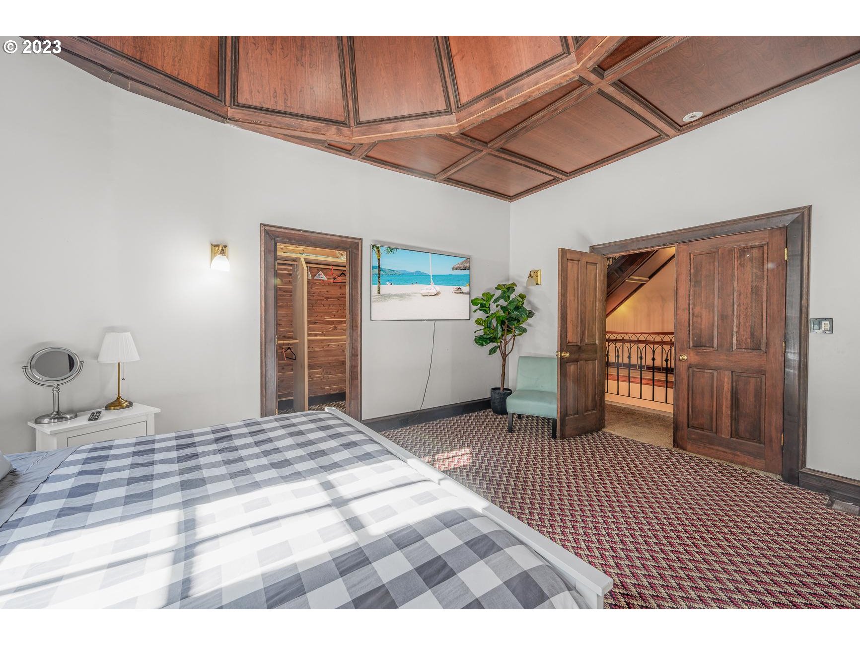 4224 Southwest Melville Avenue Portland, OR 97239 - Photo 25 of 48 a bedroom with a bed and a window