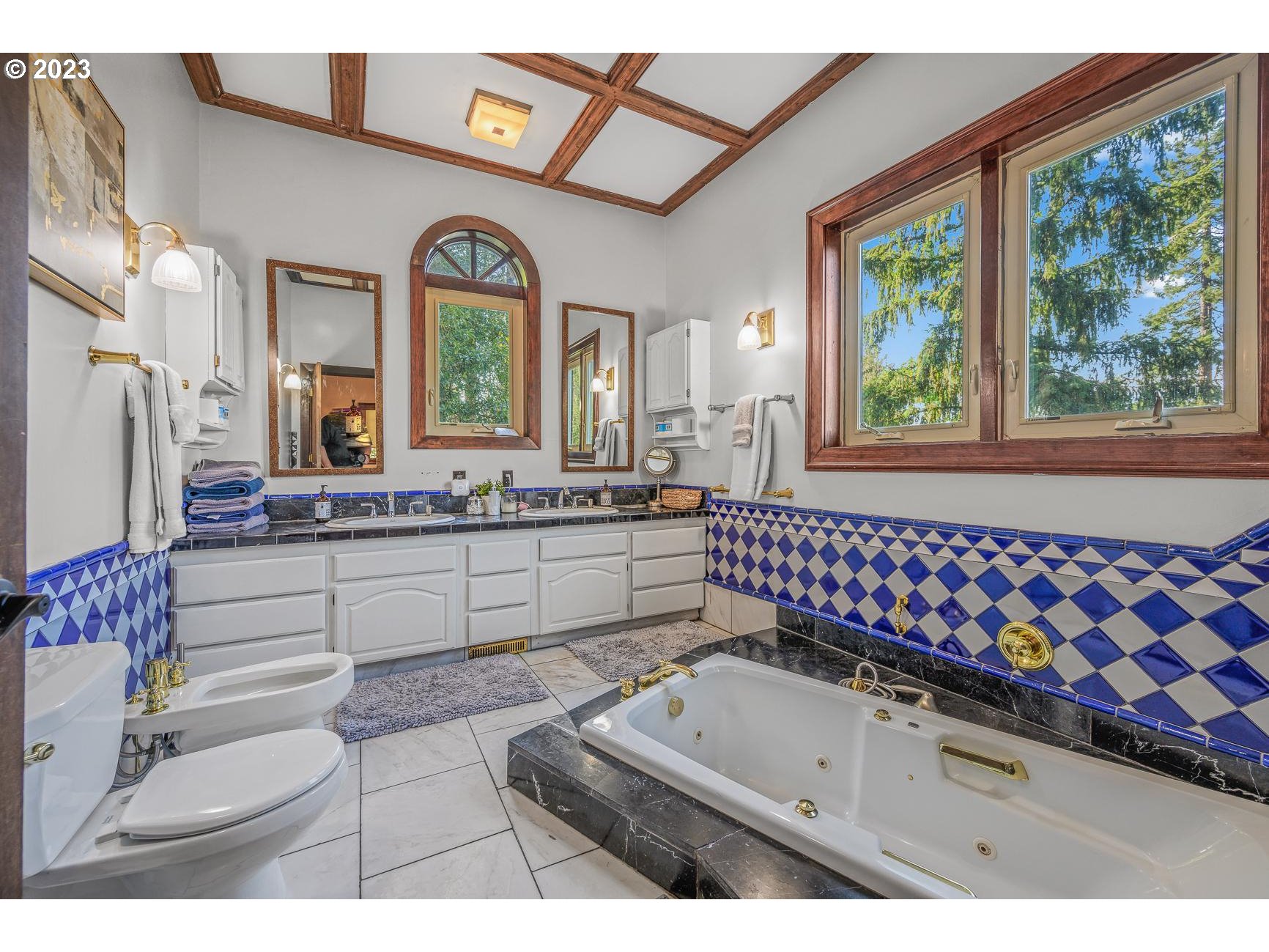 4224 Southwest Melville Avenue Portland, OR 97239 - Photo 26 of 48 a bathroom with a sink mirror and window