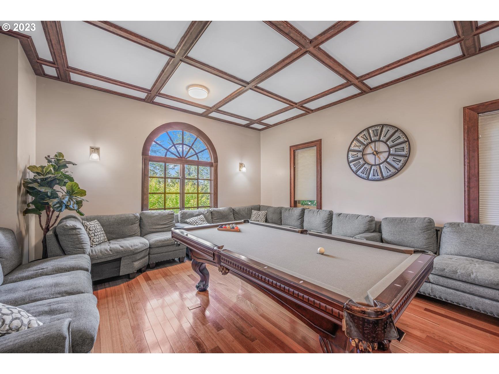 4224 Southwest Melville Avenue Portland, OR 97239 - Photo 32 of 48 a living room with furniture a chandelier and a table