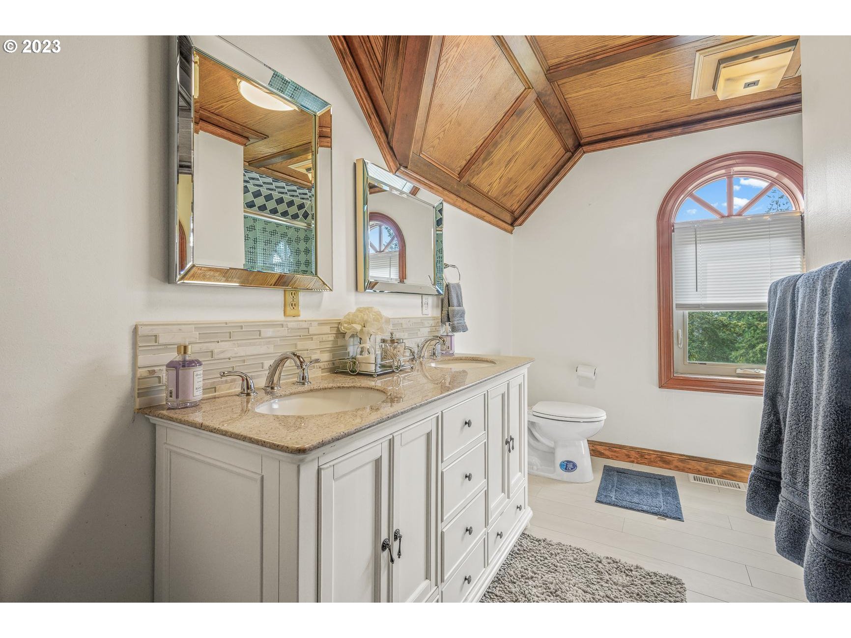 4224 Southwest Melville Avenue Portland, OR 97239 - Photo 44 of 48 a bathroom with a sink a mirror and a toilet