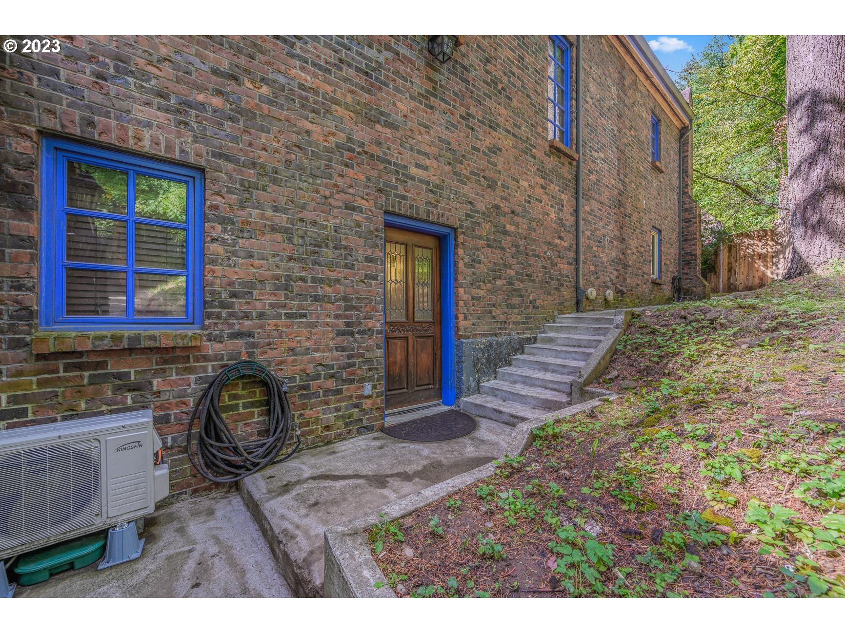 4224 Southwest Melville Avenue Portland, OR 97239 - Photo 6 of 48 a front view of a house with garden