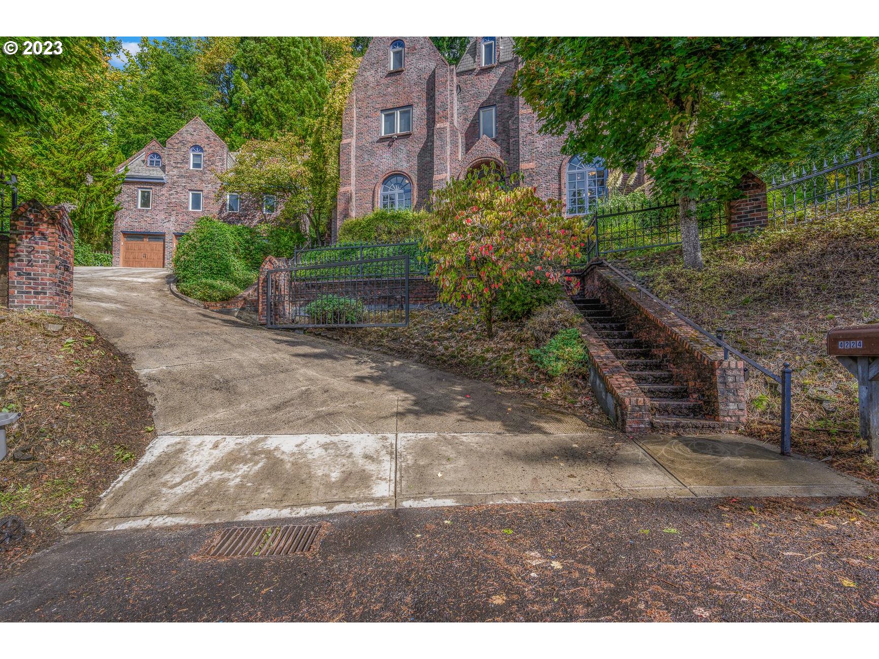 4224 Southwest Melville Avenue Portland, OR 97239 - Photo 7 of 48 a backyard of a house with lots of green space