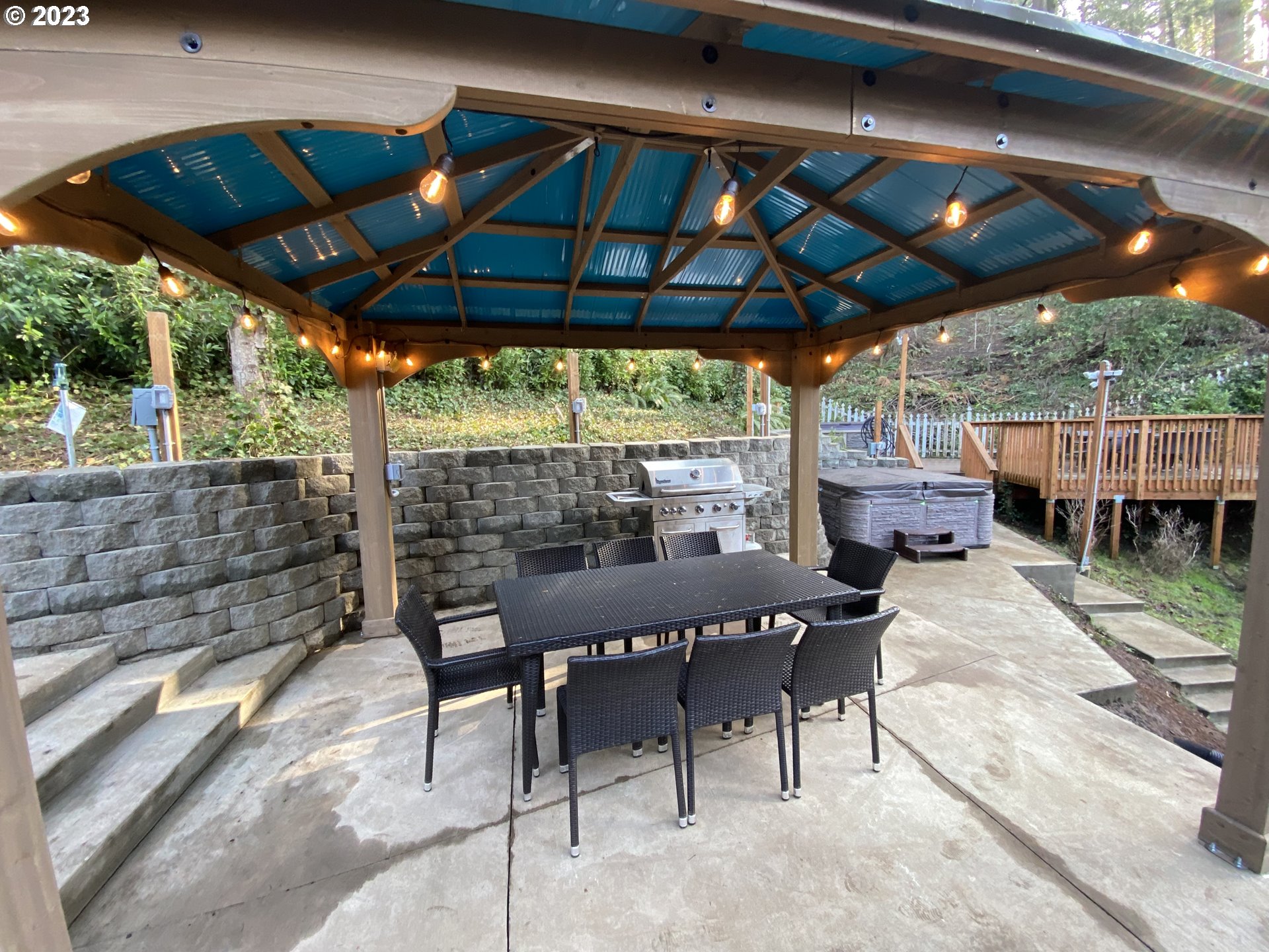 4224 Southwest Melville Avenue Portland, OR 97239 - Photo 10 of 48 a patio with glass top table and chairs