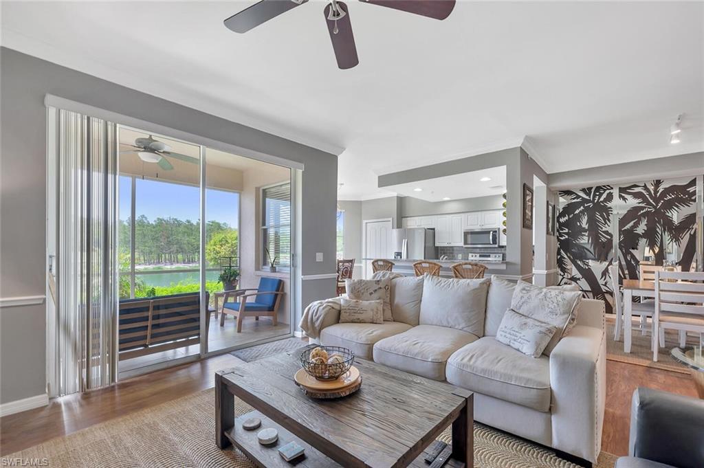 8600 Cedar Hammock Circle, Unit 1313 Naples, FL 34112 - Photo 14 of 48 a living room with furniture and a window